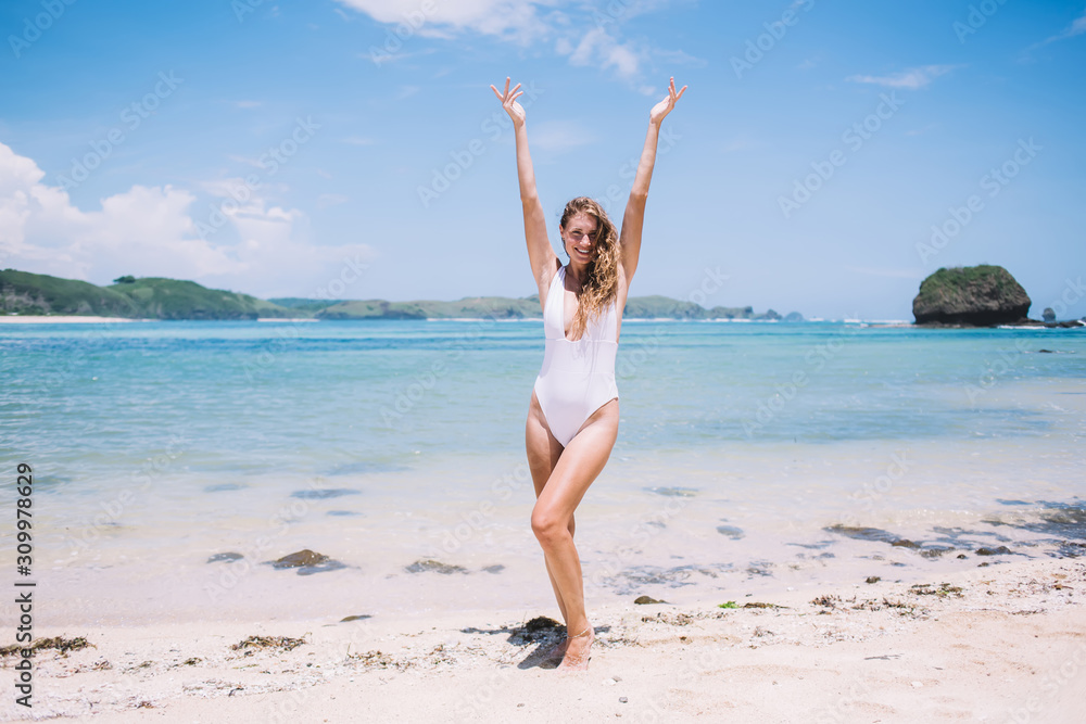Joyful woman in swimsuit having fun at seaside Joyful woman in swimsuit having fun at seaside