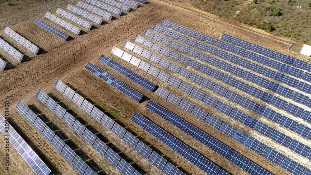 Aerial footage of solar panels absorbing sun rays and produce energy ...