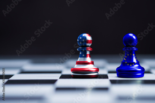 USA flag and EU flag print screen on two  pawn chess for battle.It is symbol of United States of America increase tariff tax barrier for import product from EU countries.-Image.