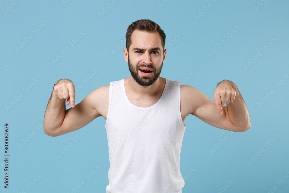 Happy bearded young man 20s years old perfect skin wearing white shirt isolated on blue pastel wall background, studio portrait. Skin care healthcare cosmetic procedures concept. Mock up copy space. Happy bearded young man 20s years old perfect skin wearing white shirt isolated on blue pastel wall background, studio portrait. Skin care healthcare cosmetic procedures concept. Mock up copy space.