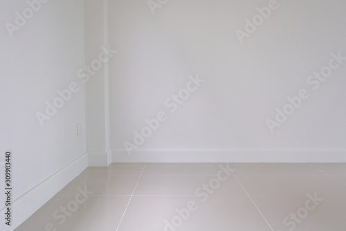 empty room interior, white mortar wall and clean tile floor in a new house