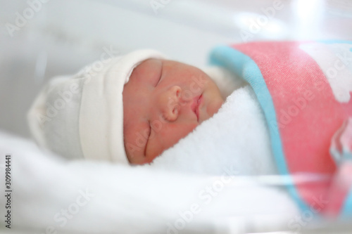 cute little newborn baby sleeping sweet dream in soft blanket