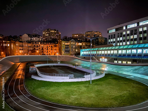 Cycle track at nigh at the city buildings