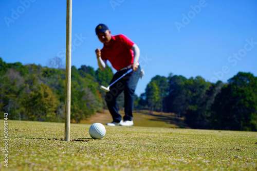 Golfer playing golf in beautiful golf course in the evening golf course with sunshine