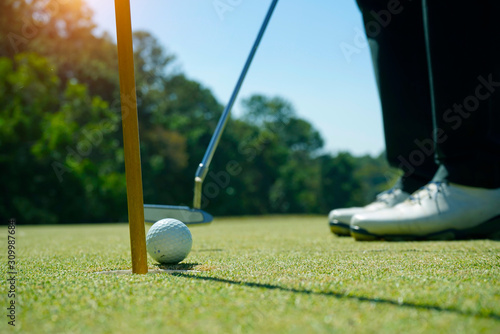 Golfer playing golf in beautiful golf course in the evening golf course with sunshine