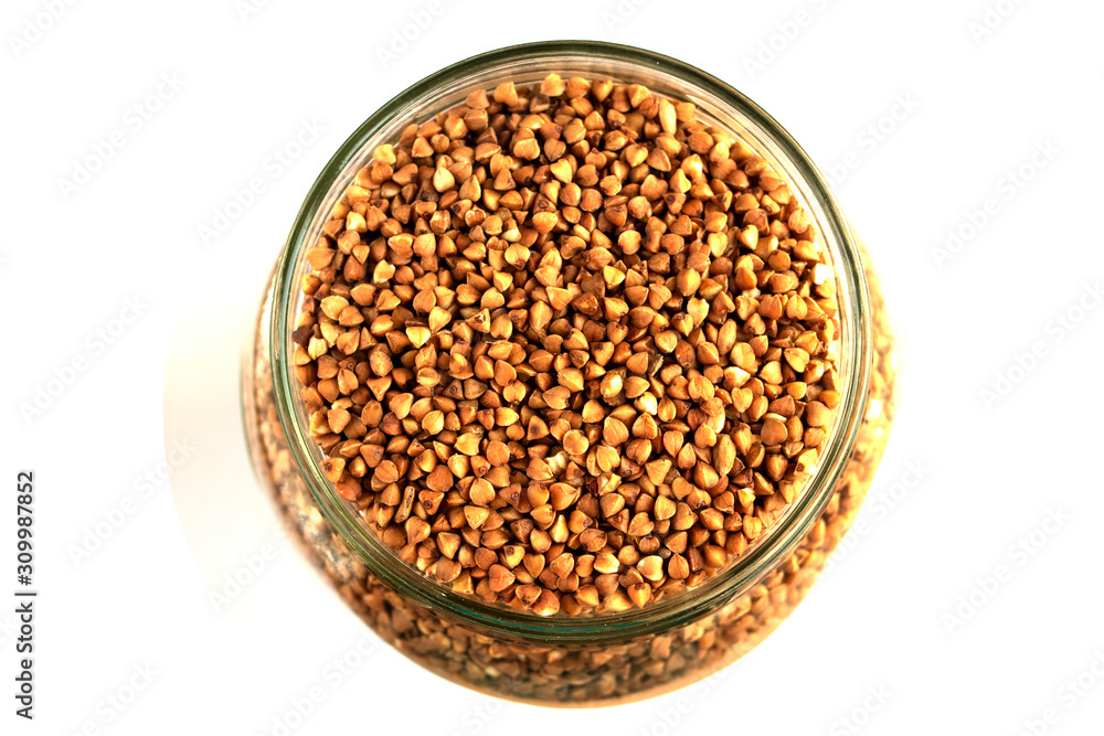 glass jar with buckwheat on white isolate background glass jar with buckwheat on white isolate background