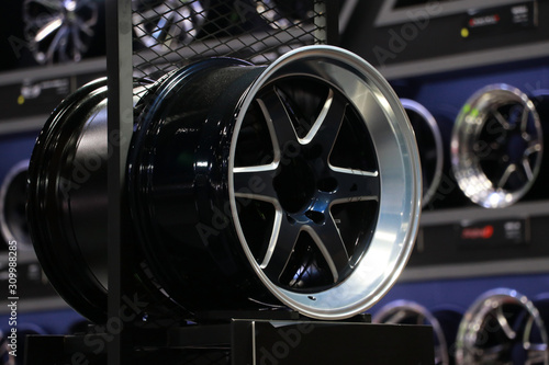 Alloy Wheel of car on the shelf. Alloy wheels are wheels that are made from an alloy of aluminium or magnesium. Alloys are mixtures of a metal.
