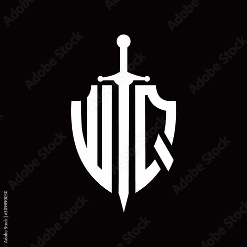 WQ logo with shield shape and sword design template photo