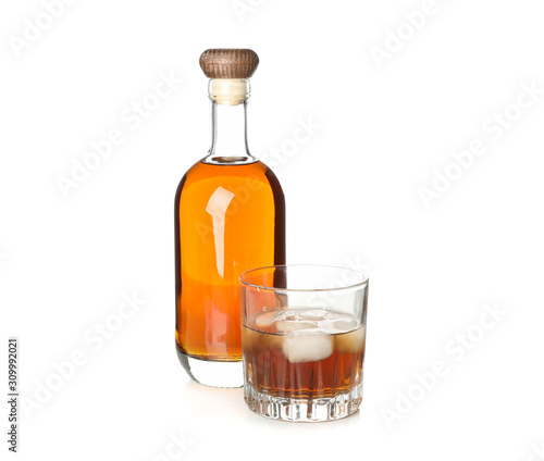 Bottle and glass with whiskey isolated on white background