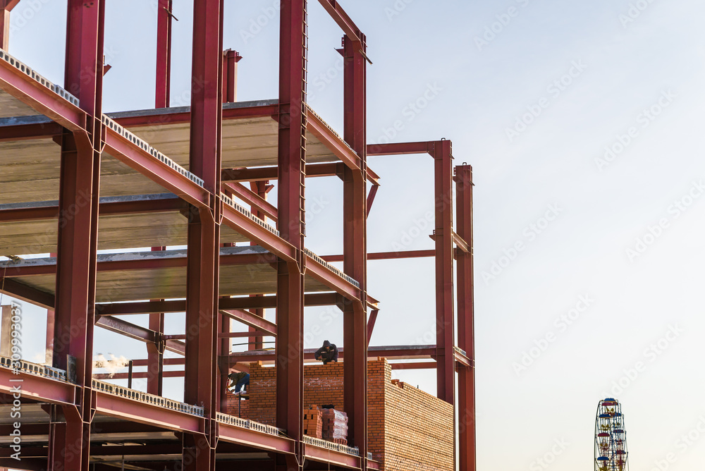 construction of the building of metal structures, metal frame roof. Steel design for the construction of the building against the sky. construction of the building of metal structures, metal frame roof. Steel design for the construction of the building against the sky.