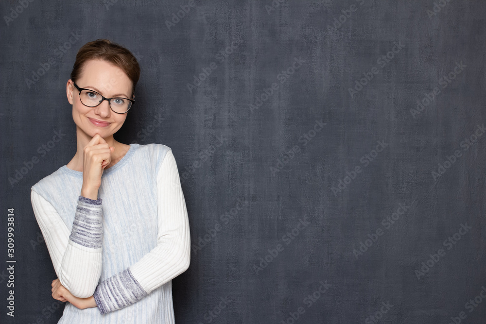 Portrait of happy young woman smiling cheerfully, being in good mood