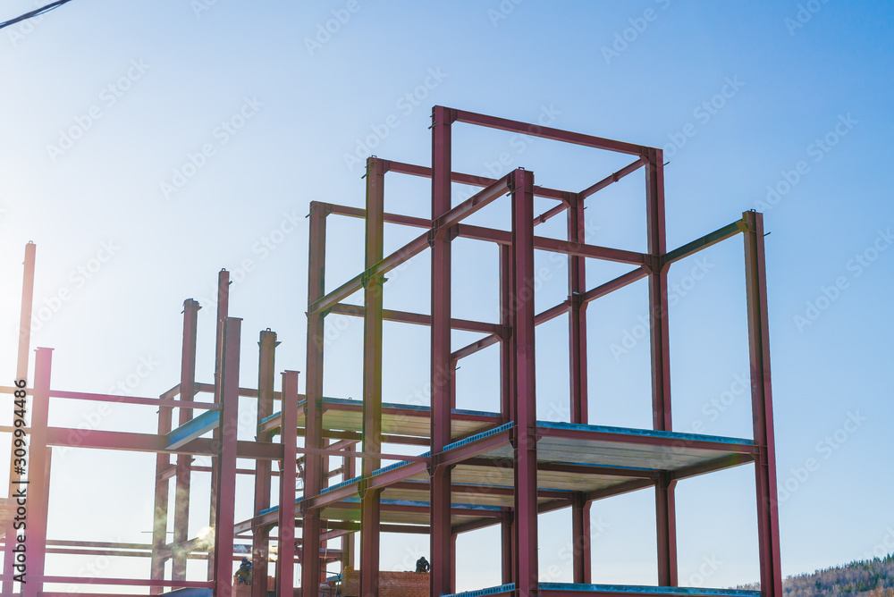 construction of the building of metal structures, metal frame roof. Steel design for the construction of the building against the sky. construction of the building of metal structures, metal frame roof. Steel design for the construction of the building against the sky.