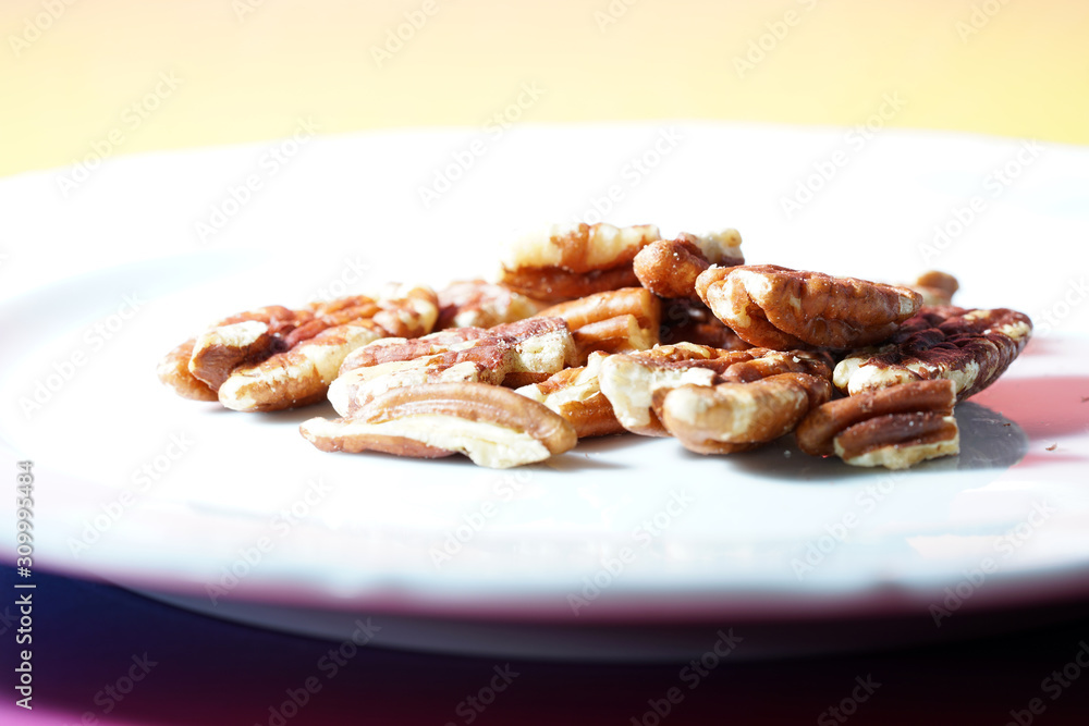 The pecan kernels taste similar to the walnut kernels, photographed here as a detail in the studio The pecan kernels taste similar to the walnut kernels, photographed here as a detail in the studio