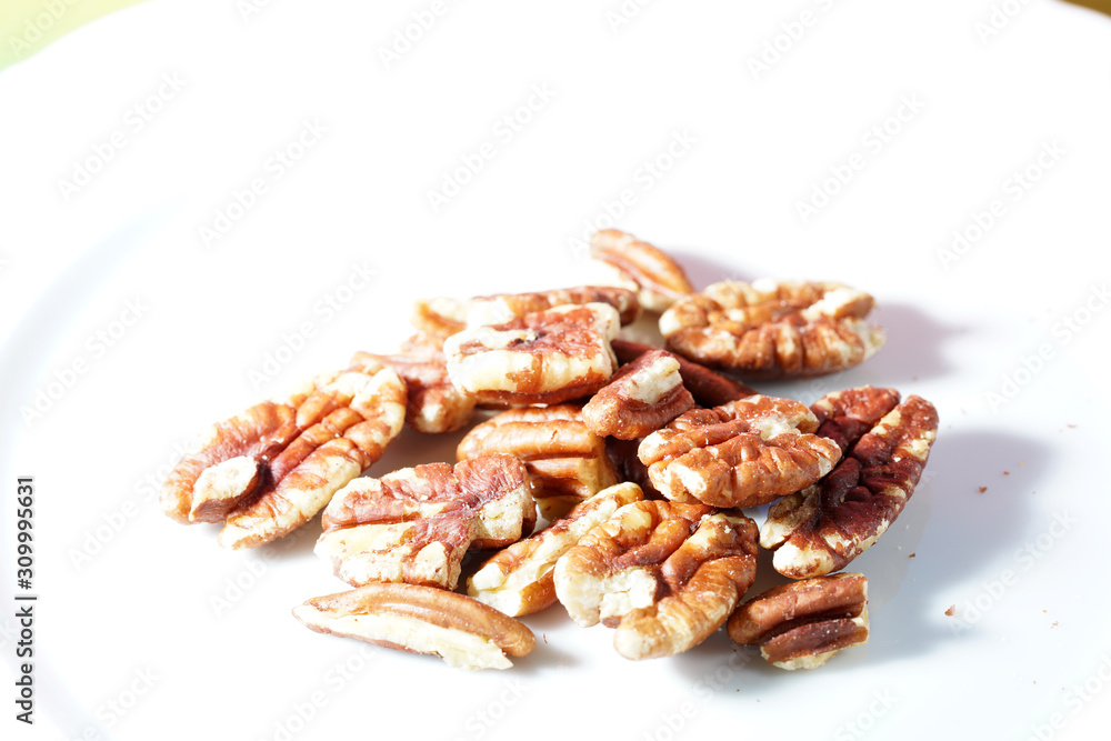 The pecan kernels taste similar to the walnut kernels, photographed here as a detail in the studio The pecan kernels taste similar to the walnut kernels, photographed here as a detail in the studio