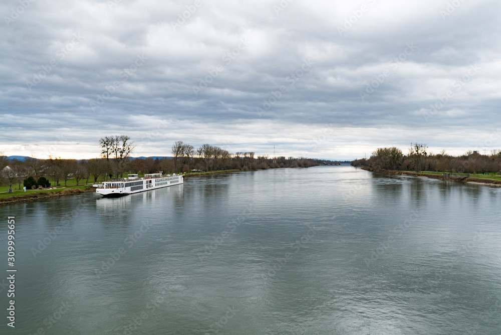 the Rhine river and an anchored river cruise ship near Strasbourg