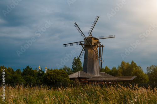 Old wooden windmill in the autmn field