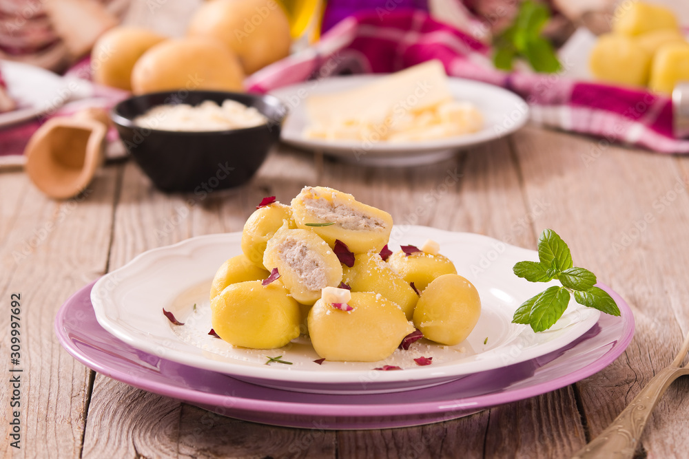 Potato gnocchi stuffed with radicchio and ricotta.