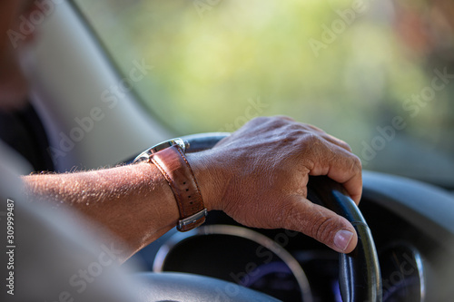 hand on steering wheel