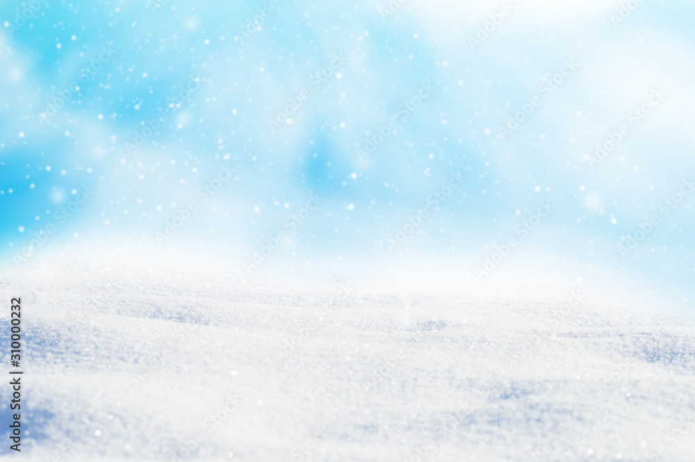 Decorative Christmas background with winter snowy blurred bokeh flakes of snow fall