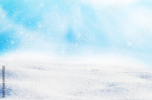 Decorative Christmas background with winter snowy blurred bokeh flakes of snow fall