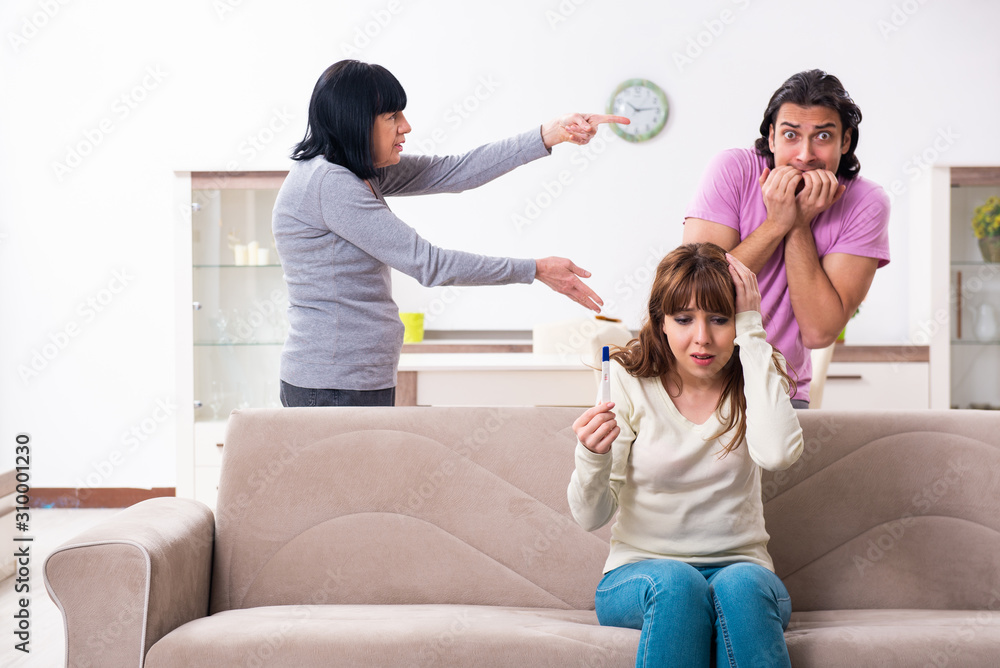 Fototapeta premium Young family and mother-in-law in family issues concept