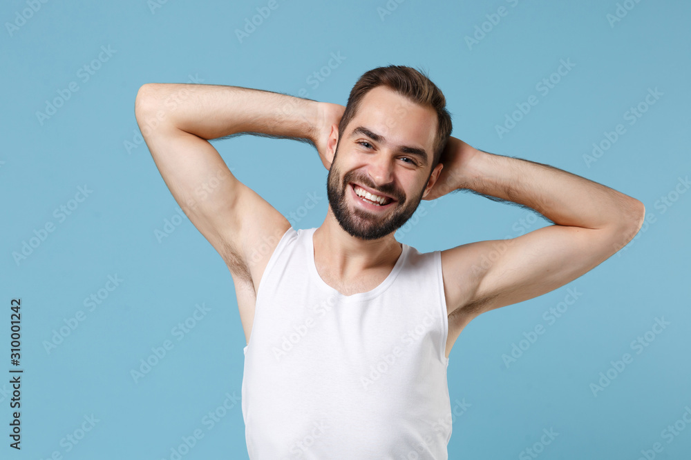 Close up bearded young man 20s years old perfect skin wearing white shirt isolated on blue pastel wall background, studio portrait. Skin care healthcare cosmetic procedures concept. Mock up copy space Close up bearded young man 20s years old perfect skin wearing white shirt isolated on blue pastel wall background, studio portrait. Skin care healthcare cosmetic procedures concept. Mock up copy space