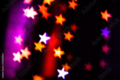 Festive overlay effect. Colorful stars bokeh festive glitter background. Christmas, New Year and Valentine's day design