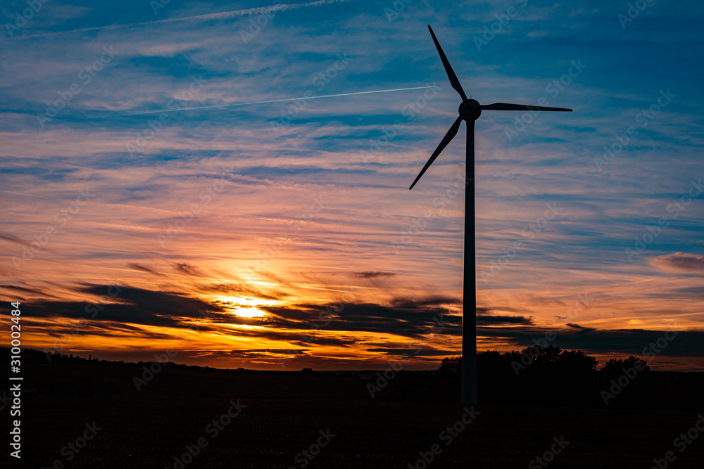 Obraz premium Beautiful sunset with wind power plant silhouette near Kugl, Bavaria, Germany