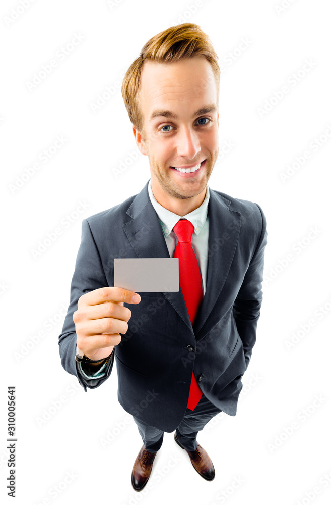 Full body picture of funny businessman in black confident style suit and red tie, showing blank business or plastic credit card, with copy space for text or slogan, isolated on white Full body picture of funny businessman in black confident style suit and red tie, showing blank business or plastic credit card, with copy space for text or slogan, isolated on white