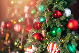 Decorated European American Christmas tree red and green color, close-up of toys and decor striped candy