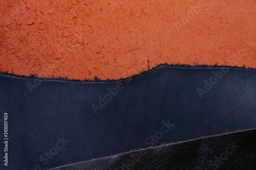 three pieces of raw leather, different colors. horizontal background