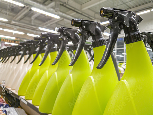 Wallpaper Mural green plastic bottles with black spray bottles closeup Torontodigital.ca