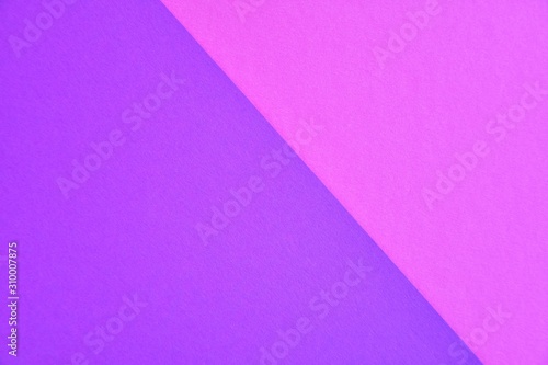 Two tone paper background with violet and purple color. Blank colorful backdrop with empty space for image or text. Mockup concept. Neon empty paper background. Clean purple and violet wallpaper 