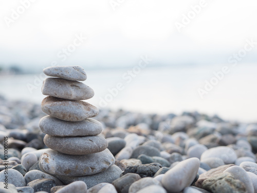 Photography Pyramid of smooth stones on the beach