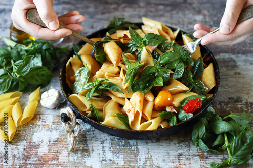 Canvas Print One pan pasta with basil. Vegan pasta. Selective focus. Macro.