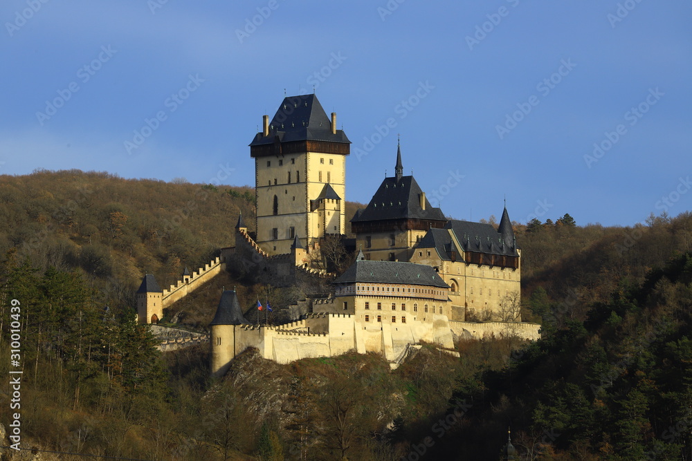 Karlstejn is a medieval castle on the slopes of a high cliff