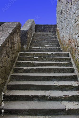 Stone stair in the ancient castle vertical