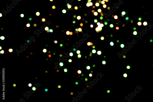 big green and golden bokeh for background on black. Christmas lights. overlay layer