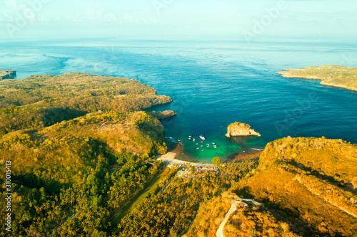 Fototapeta Naklejka Na Ścianę i Meble -  Aerial view, on Crystal bay with scenery boat and crystal clear sea lagoon and beautiful island in sea water.