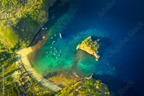 Aerial view, on Crystal bay with scenery boat and crystal clear sea lagoon and beautiful island in sea water.