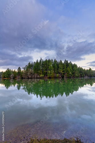 Fototapeta Naklejka Na Ścianę i Meble -  Sky Reflections In The Waters Of Mud Bay, Puget Sound, Olympia, Washington