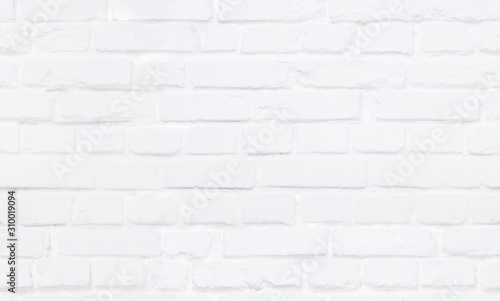 Seamless white brick wall background. Authentic masonry work tile block surface