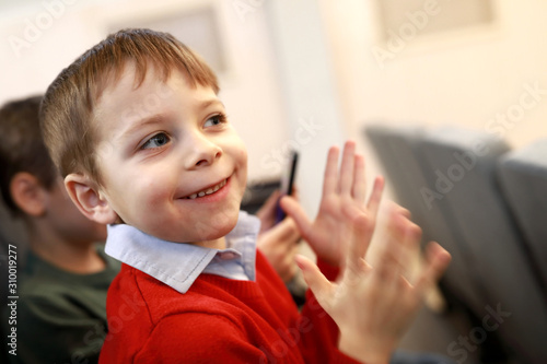 Child applauds in theater