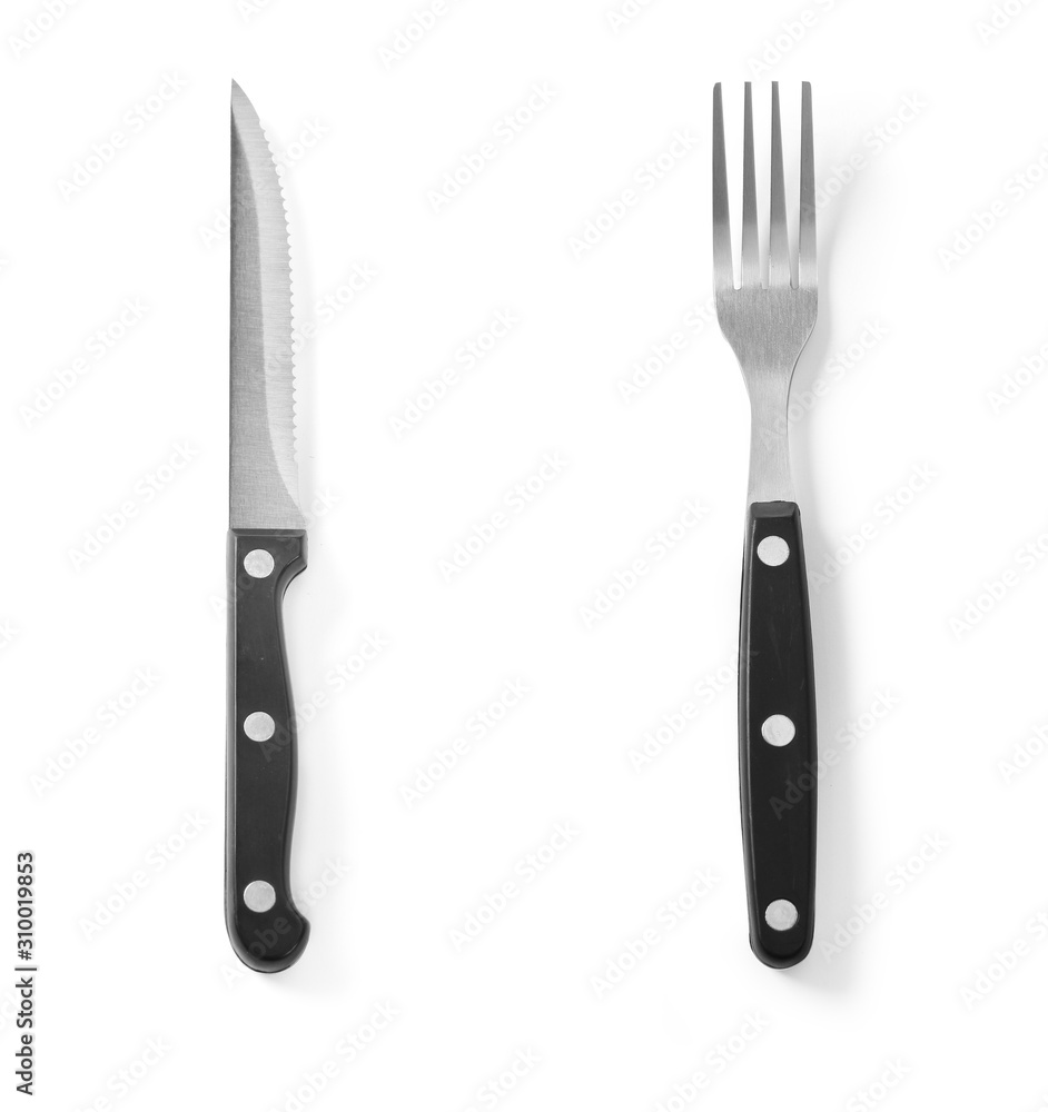 Steak cutlery set knife and fork stainless steel isolated on white background Steak cutlery set knife and fork stainless steel isolated on white background