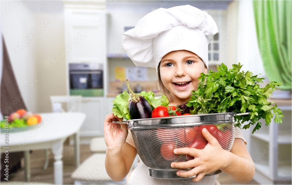 Happy little girl with vegetables on background Happy little girl with vegetables on background