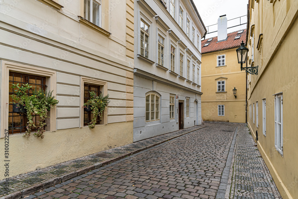 Old street view in Prague, Czech Republic.  Deserted street with paving stones