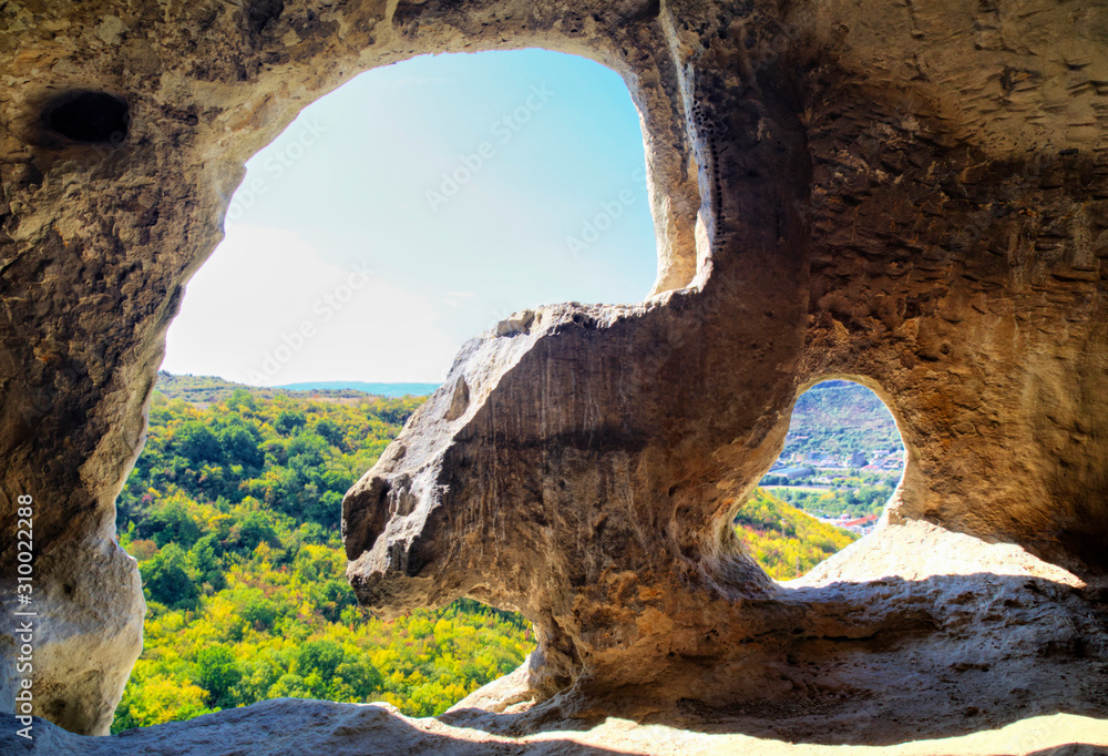 Fototapeta premium Beautiful view from inside of the cave to the outside nature