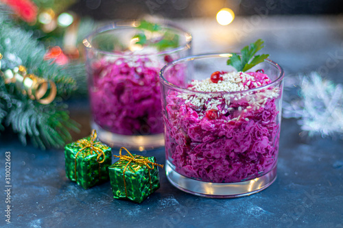 Holiday salad of beets and soft cheese in glasses. Added sesame seeds and chanok.