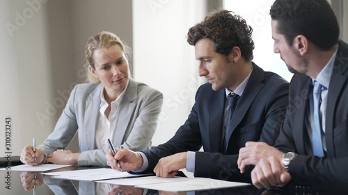 Business people negotiating commercial contract