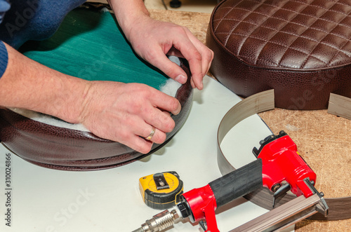 Seat upholstery in a furniture workshop, eco-leather cover photo